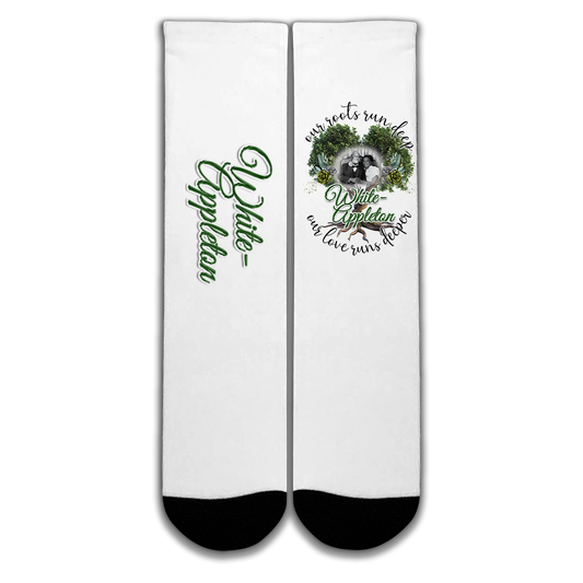 White socks with black toe and heel featuring White-Appleton lineage photo and “Our Roots Run Deep” message.
